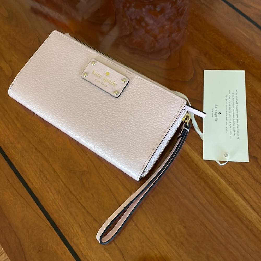 Kate Spade Wallet, never used.  Pink!  Smoke free, pet free home.